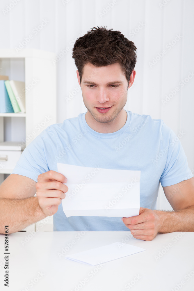 Happy Man Looking At Paper Happy Man Looking At Paper