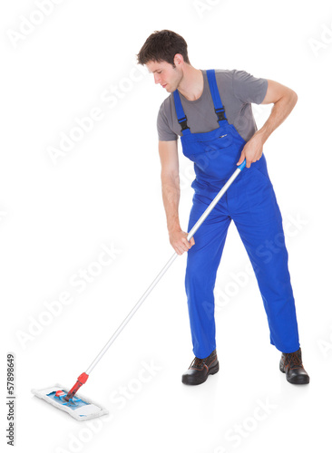 Young Man Cleaning With Mop