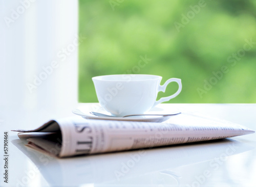 newspaper and coffee cup