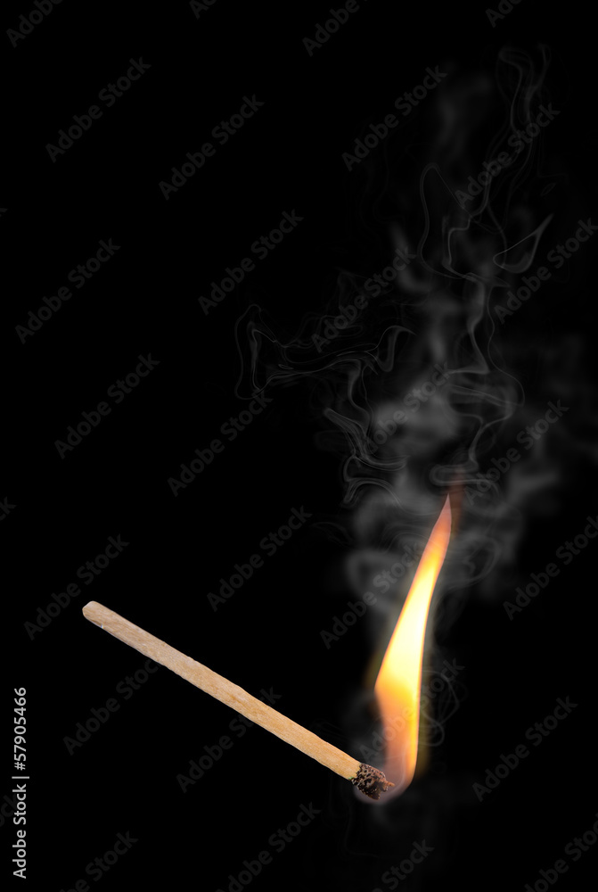 A lit match. Isolated on a black background