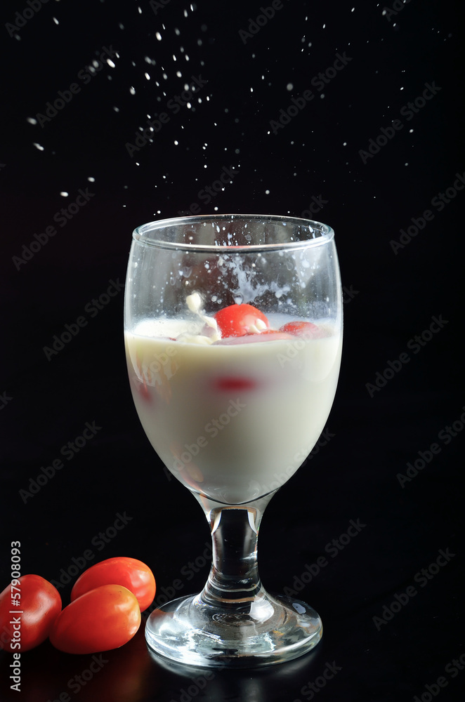 milk splash on black background milk splash on black background