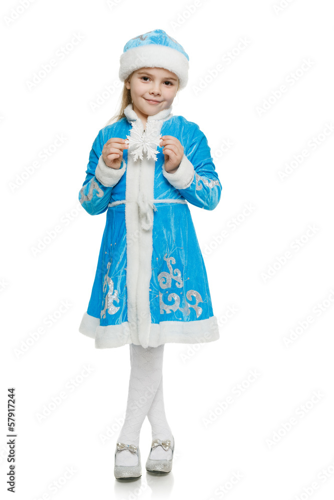 Little girl in blue costume of snow maiden showing snowflake Little girl in blue costume of snow maiden showing snowflake