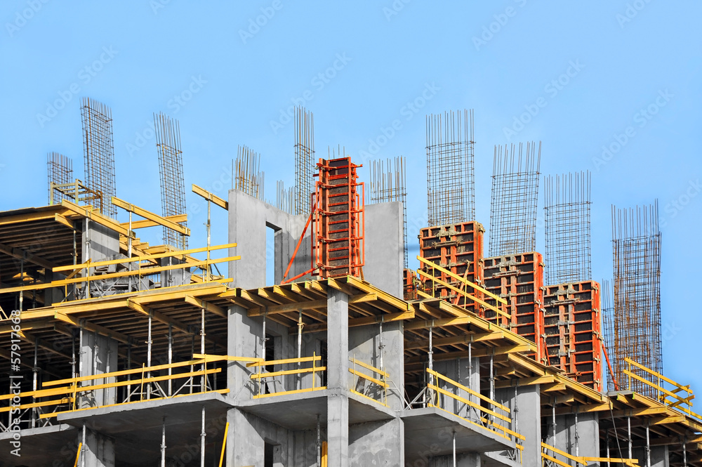 Building construction site work against blue sky Building construction site work against blue sky
