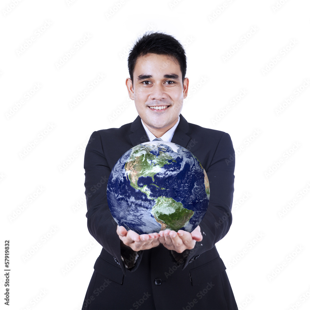 Isolated businessman holding a globe Isolated businessman holding a globe