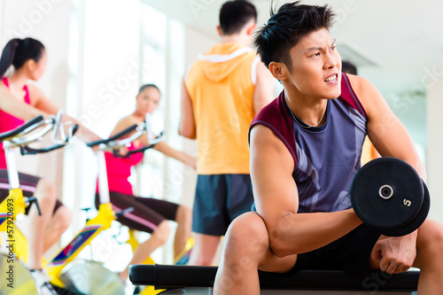 Fototapeta Naklejka Na Ścianę i Meble -  Asian people exercising sport for fitness in gym