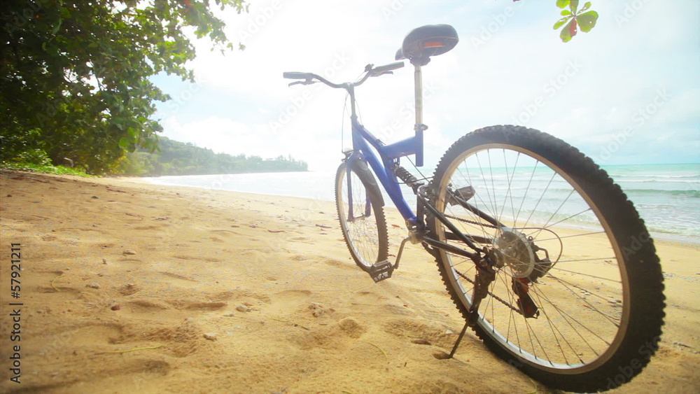 Modern bicycle on a tropical the beach without people Modern bicycle on a tropical the beach without people