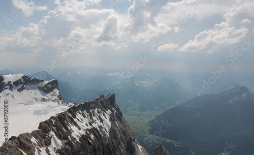 Snowy mountain peak with cloudy background