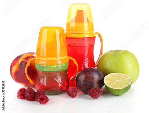 Fruits and baby bottles with compote isolated on white