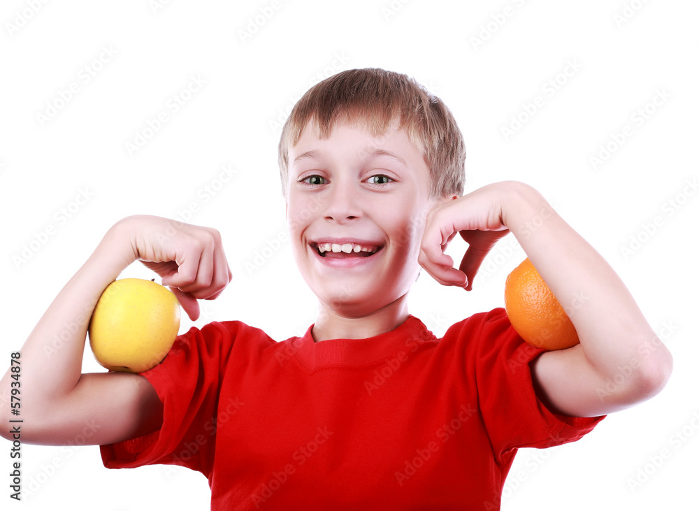 Funny boy in red with apple and orange. Fitness concept Funny boy in red with apple and orange. Fitness concept