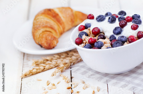 Muesli with yogurt  and berry  with tasty croissant
