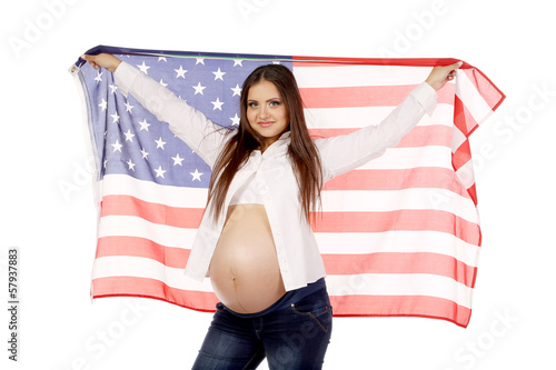 Pregnant woman with american flag photo