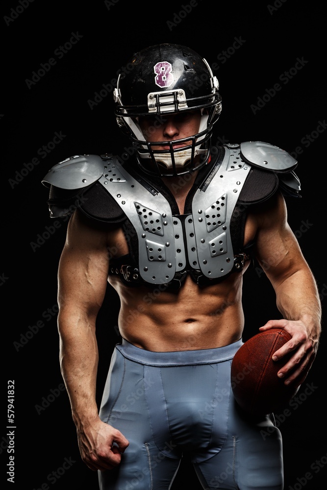 American football player wearing helmet and protective armour