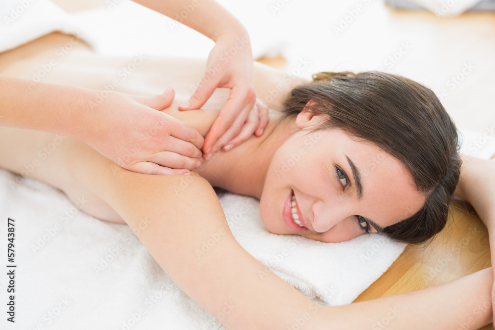 Smiling beautiful woman enjoying shoulder massage at beauty spa Smiling beautiful woman enjoying shoulder massage at beauty spa