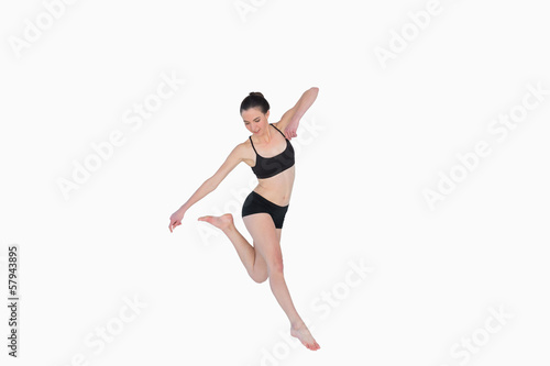 Full length of a sporty young woman jumping © lightwavemedia