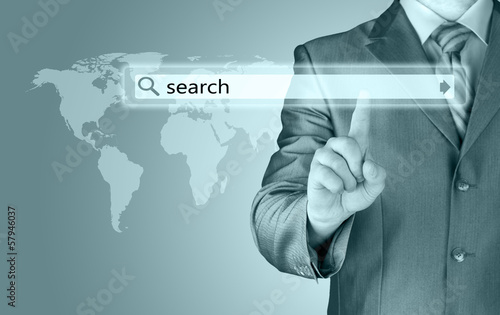 Businessman pushing virtual search bar