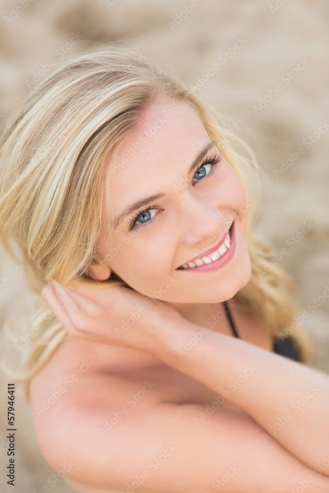 Overhead Close up portrait of smiling blond at beach Overhead Close up portrait of smiling blond at beach