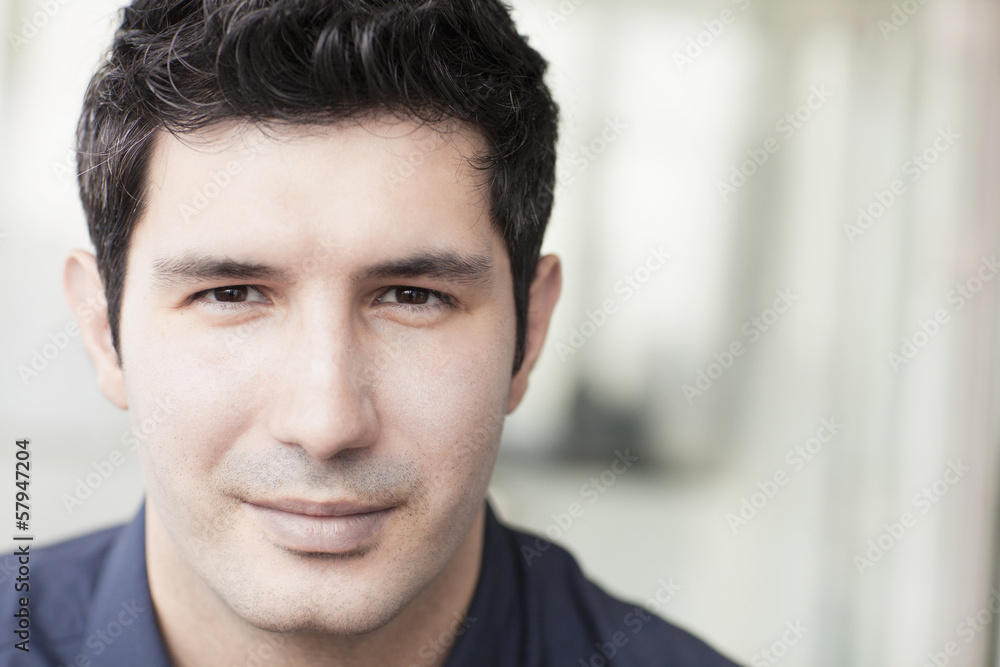 Portrait of smiling businessman looking at camera Portrait of smiling businessman looking at camera