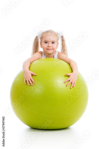 Child girl having fun with gymnastic ball isolated