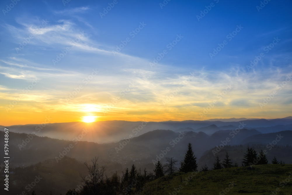 Fototapeta premium sunrise over black forest mist