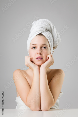 beautiful young girl wearing white towel on her head