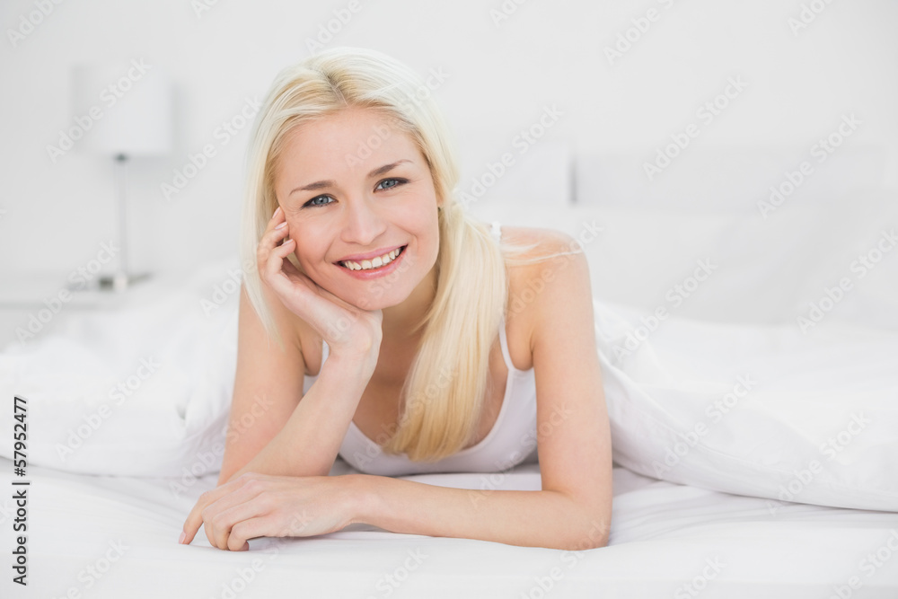 Portrait of a beautiful smiling young blond in bed Portrait of a beautiful smiling young blond in bed