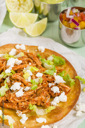 Tostadas - Mexican crispy tortilla with chicken tinga and cotija