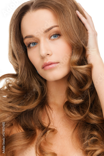 beautiful calm woman with long curly hair