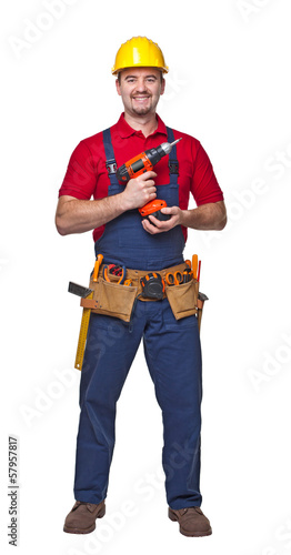 Smiling Caucasian worker standing with tool belt isolated on white © tiero