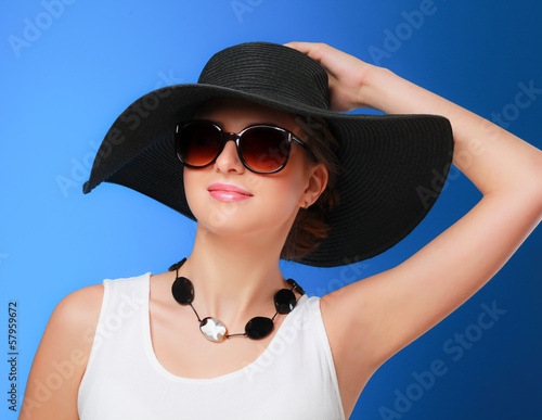 Tableau sur toile Portrait of beautiful model in hat with glasses