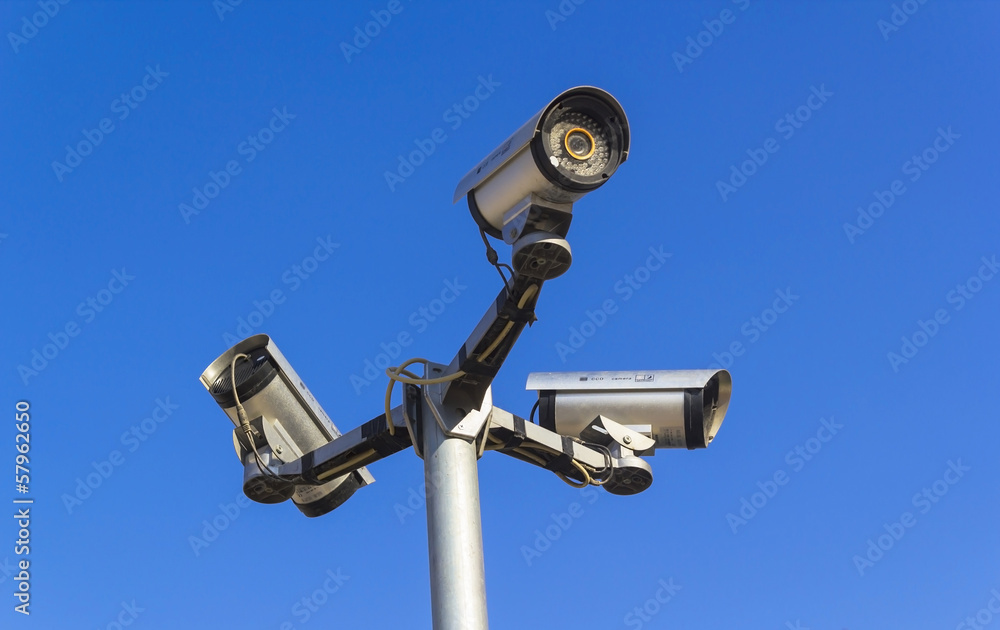 Security camera on blue sky background Security camera on blue sky background