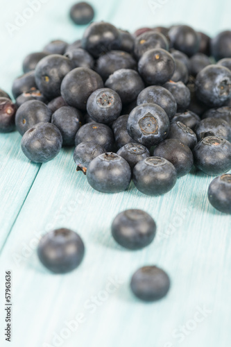 Blueberries - Delicious juicy blueberries on a blue wooden table