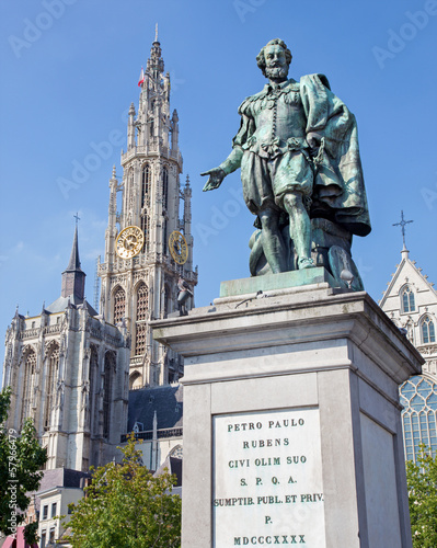 Antwerp - Statue of painter P. P. Rubens and tower of cathedral photo