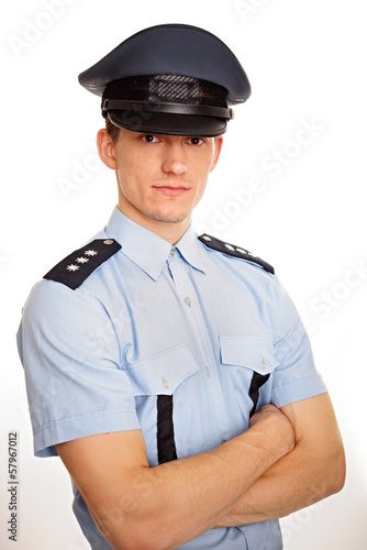 Portrait of young policeman on white background.