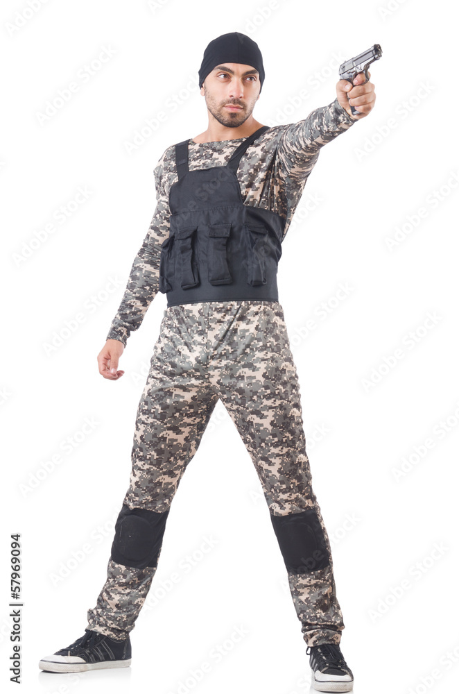 Soldier in camouflage with gun on white