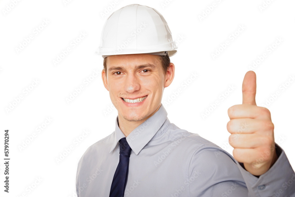 Portrait of young businessman in a helmet shows finger up. Portrait of young businessman in a helmet shows finger up.