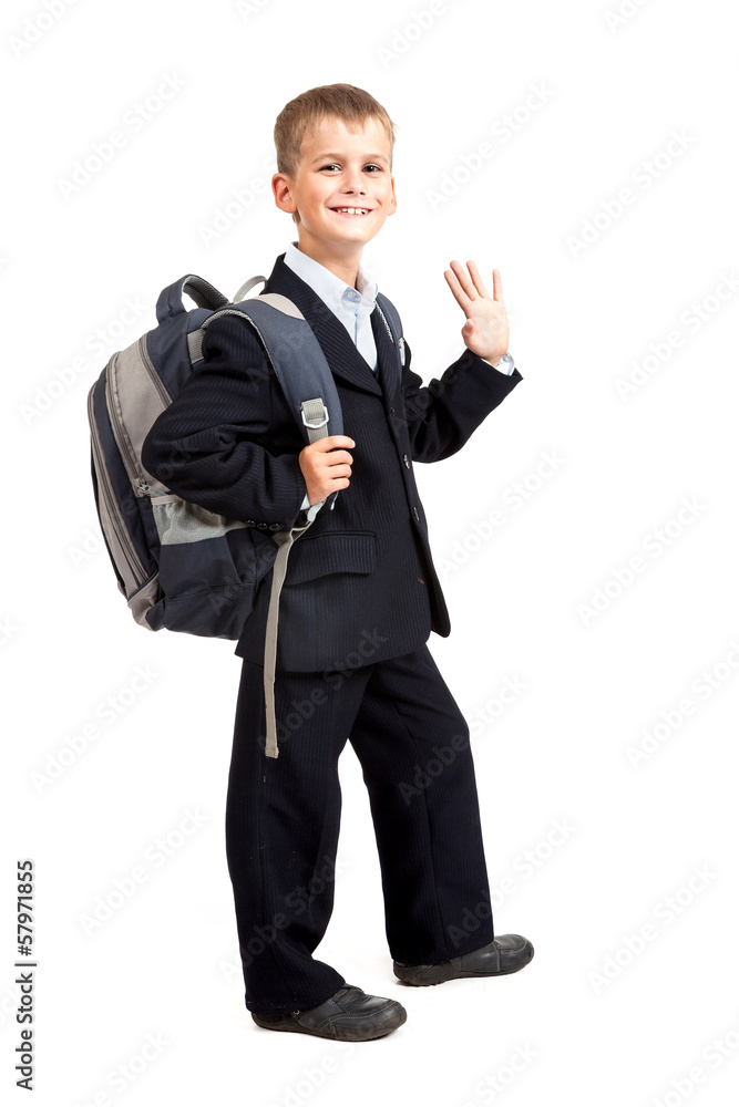 Schoolboy sitting on books