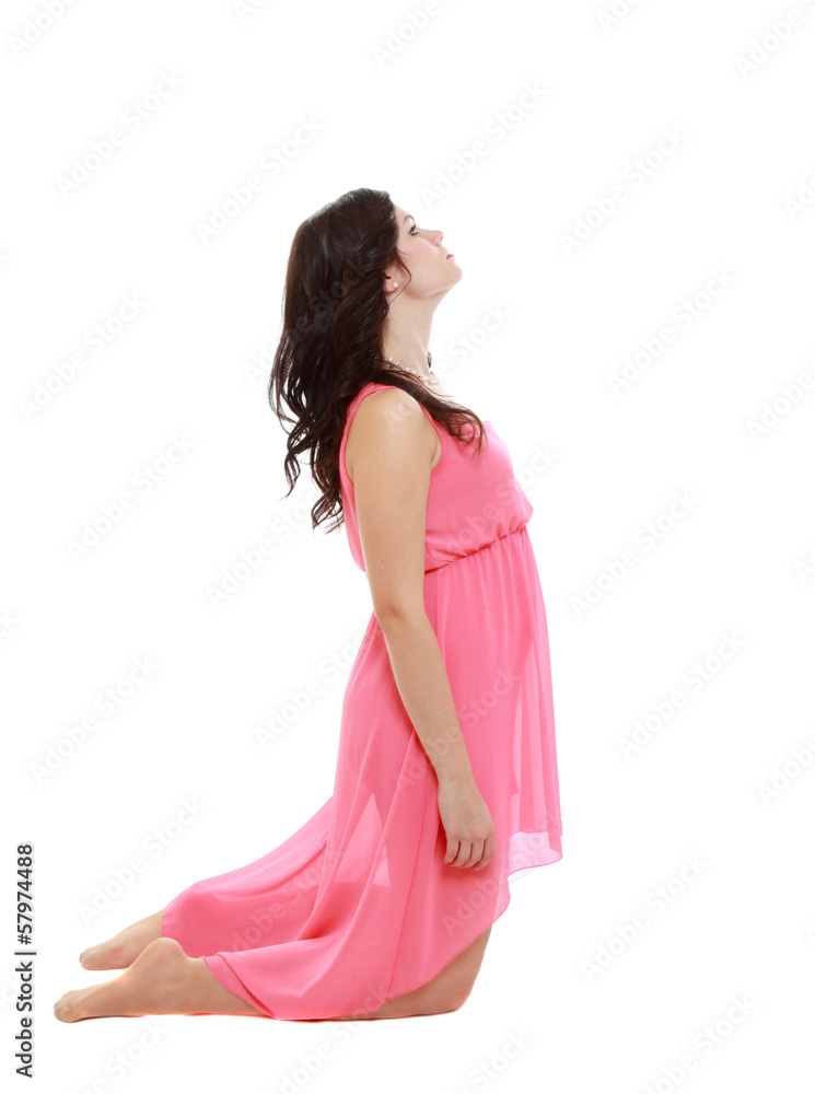 young woman praying on her knees looking upwarts young woman praying on her knees looking upwarts