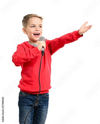 Little boy with microphone sings a song