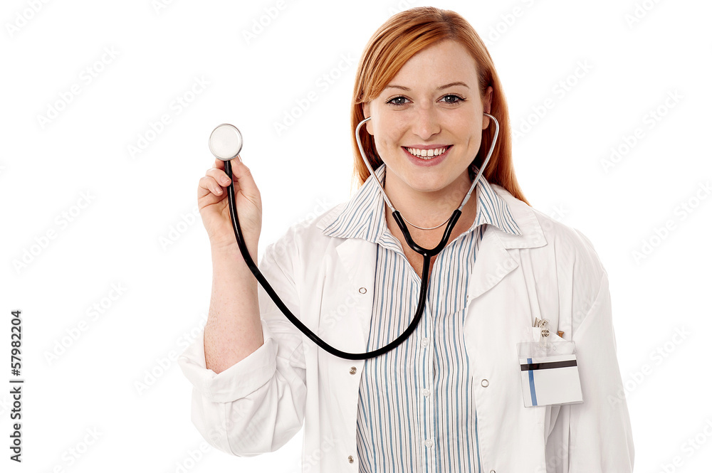 Female physician posing with stethoscope Female physician posing with stethoscope
