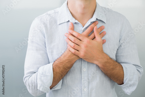 Картината върху платно Mid section of a man with chest pain