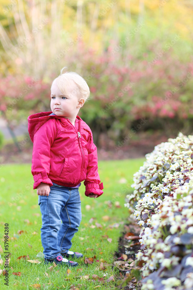 little baby girl playing in beautiful colorful park little baby girl playing in beautiful colorful park