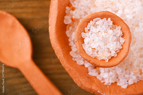 Himalayan Pink Crystal Rock salt  in rustic clay bowls photo