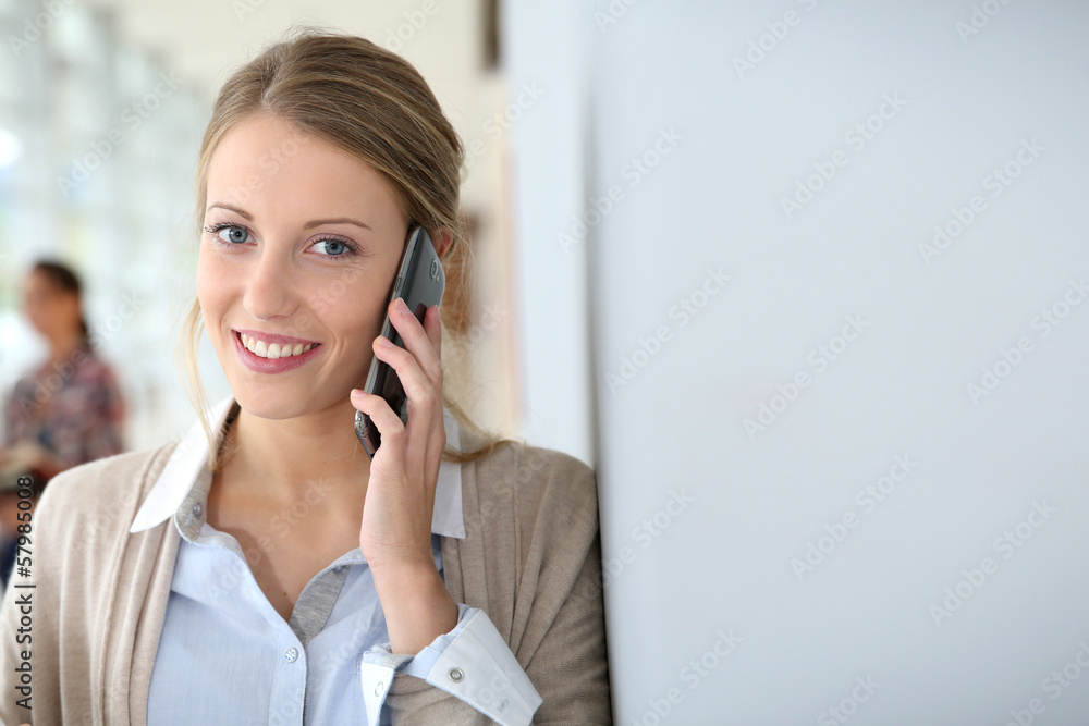 Young woman in school campus talking on phone Young woman in school campus talking on phone