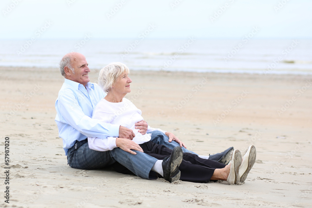Loving couple of seniors relaxing on the beach Loving couple of seniors relaxing on the beach