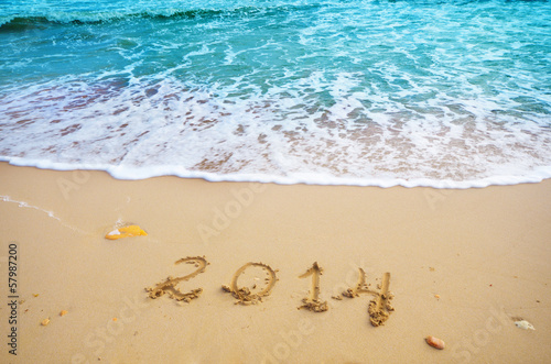 Year 2014 coming concept on beach