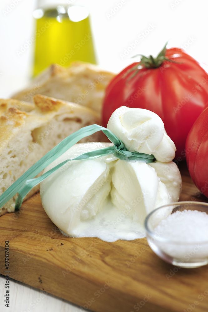 Burrata (sort of very fresh mozzarella cheese), tomato and bread Burrata (sort of very fresh mozzarella cheese), tomato and bread