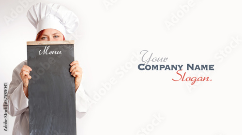 Chef behind a menu board