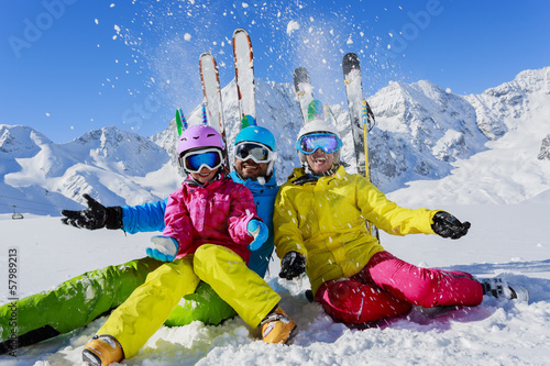Ski and fun - family enjoying winter holiday