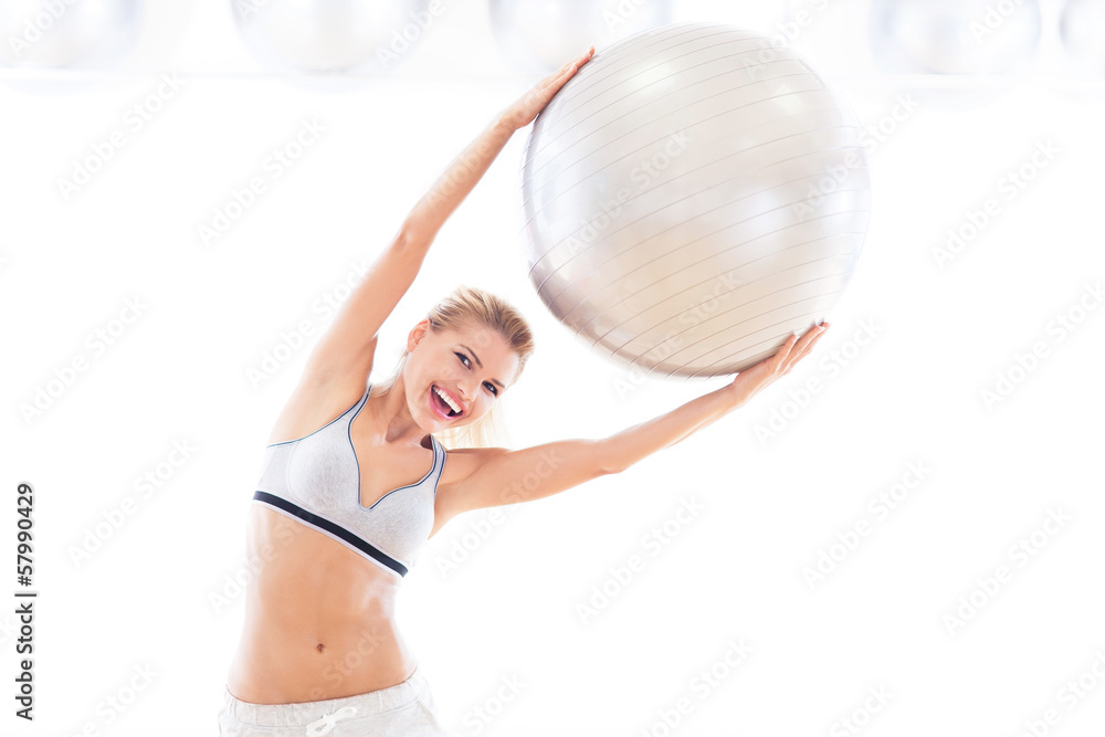 Fototapeta premium Woman holding exercise ball