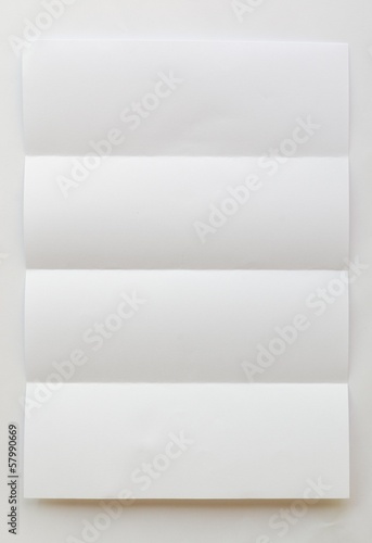 Fototapeta Naklejka Na Ścianę i Meble -  white textured sheet of paper folded